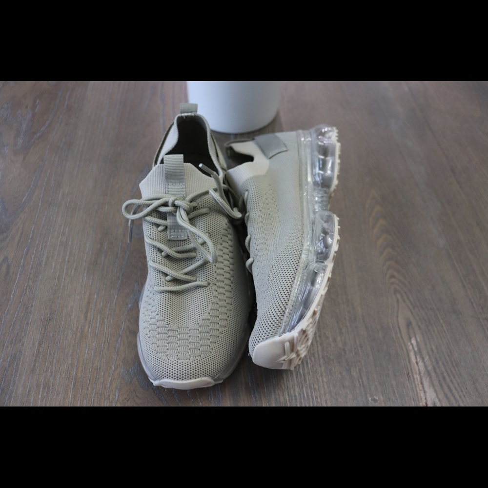 Cute,comfy brand new sneakers. Made out of stretchy material and clear sole.